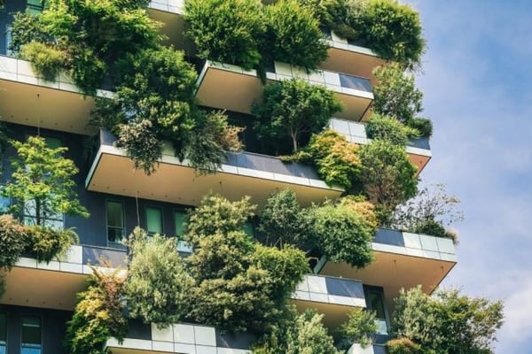 Bauhaus apartment building with trees on every floor
