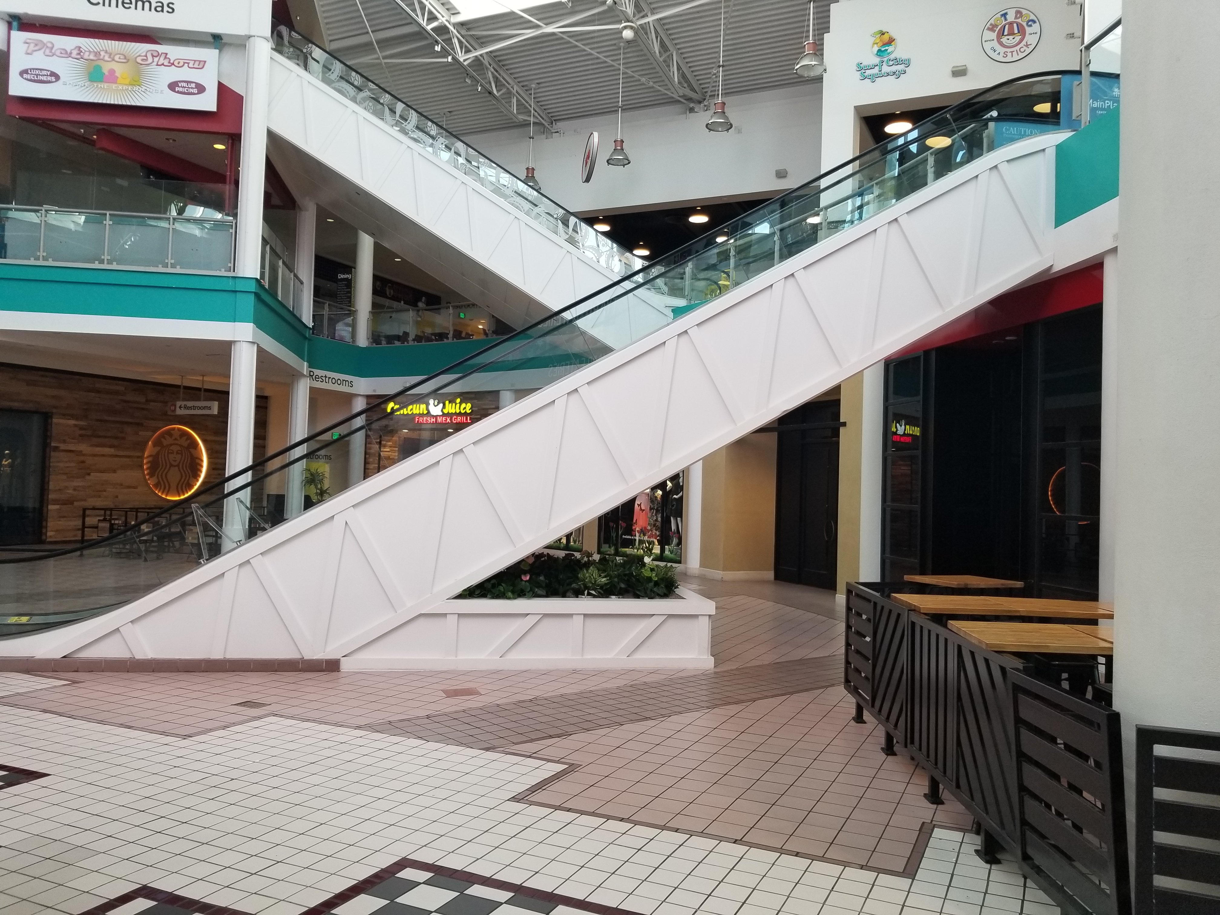 The mall escalator before the living wall was installed