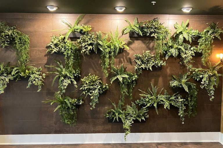  Custom faux green wall of plant-filled trays in a geometric layout on a dark tiled feature wall 