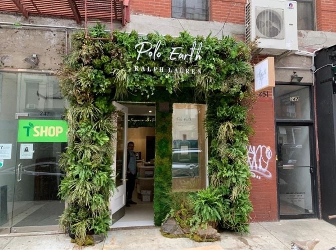 Exterior of the Ralph Lauren pop-up store in Nolita with a living wall and moss wall across the storefront