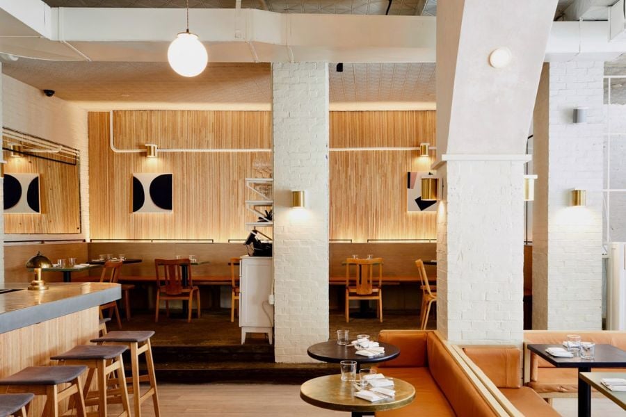 wood textured and neutrally coloured Bauhaus interior restaurant design