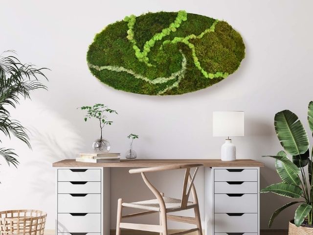 Oval shaped pre-built moss wall in a home office