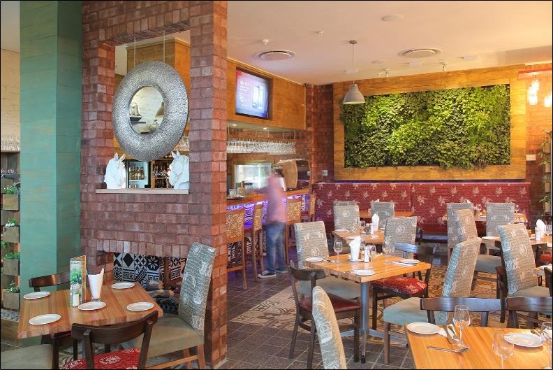 indoor restaurant with living wall