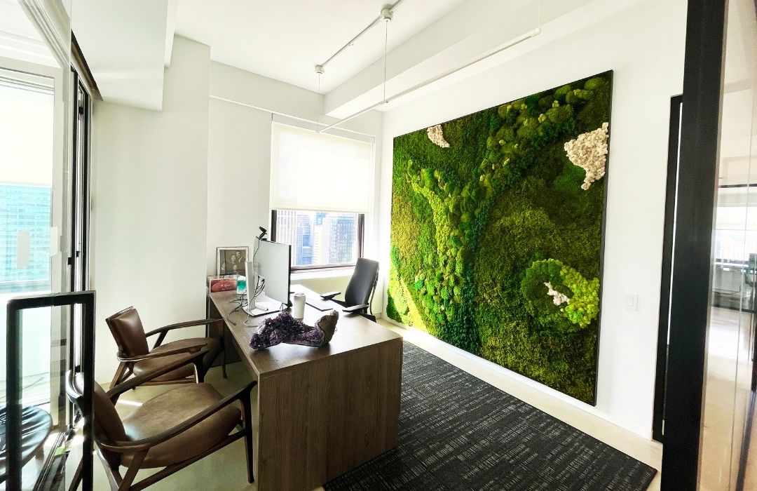 Preserved moss wall panels create a stunning and memorable backdrop to business meetings in an office. 