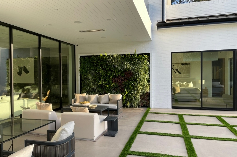 luxury outdoor lounge area with a living greenwall.