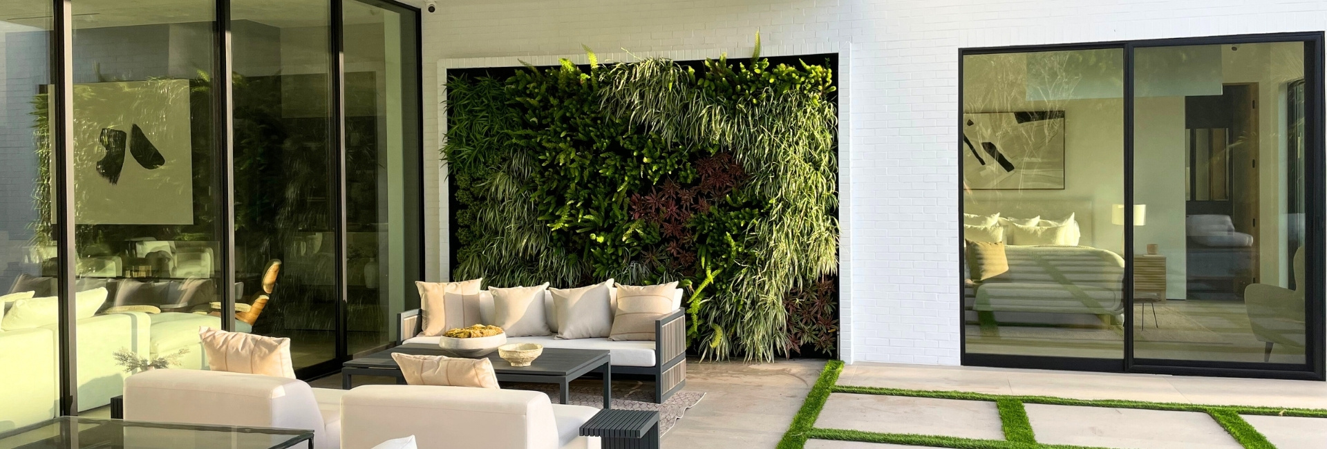 Living greenwall in an outdoor living space at a residence.